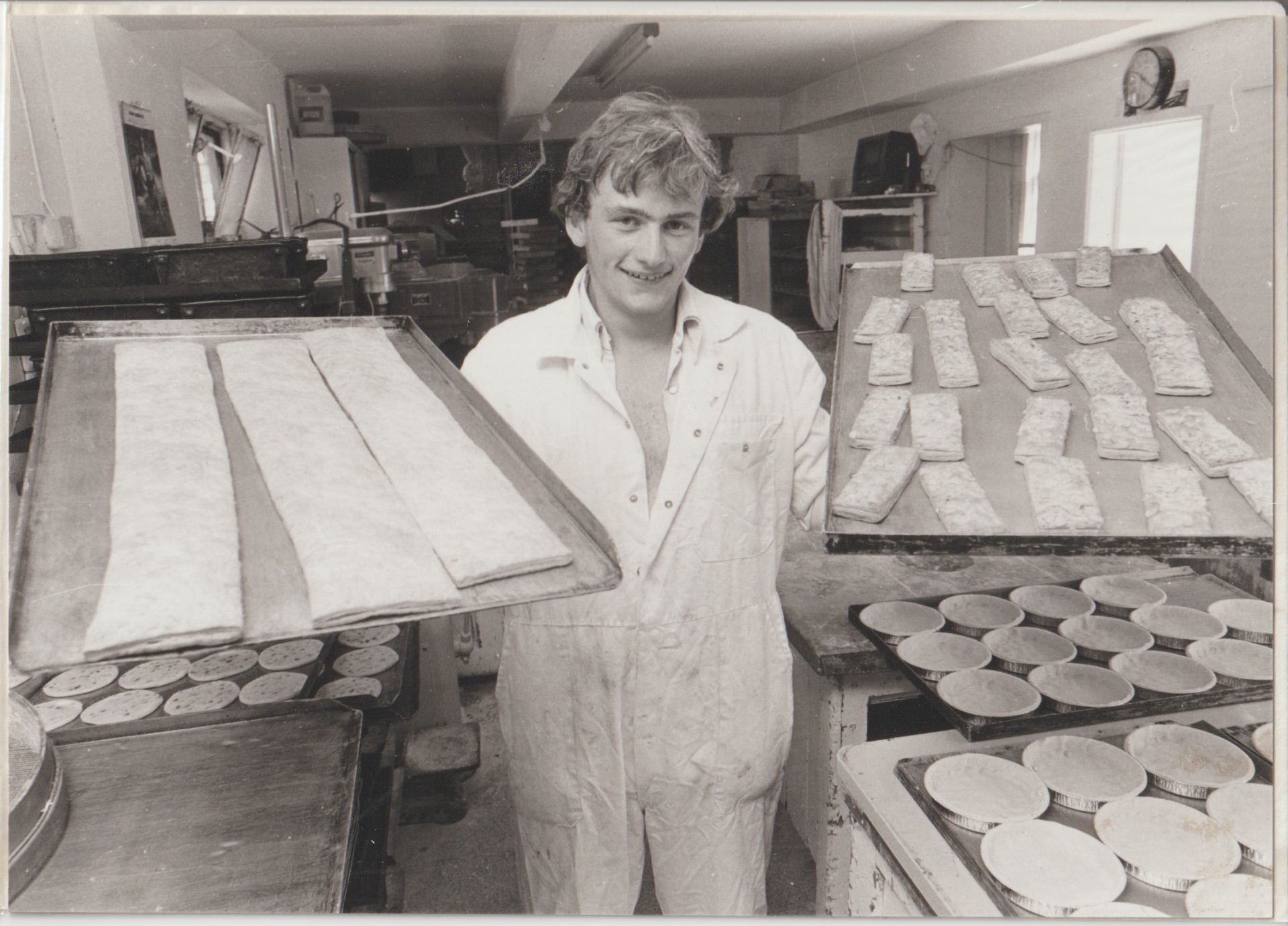 Brian in the bakery — trays of pastry ready