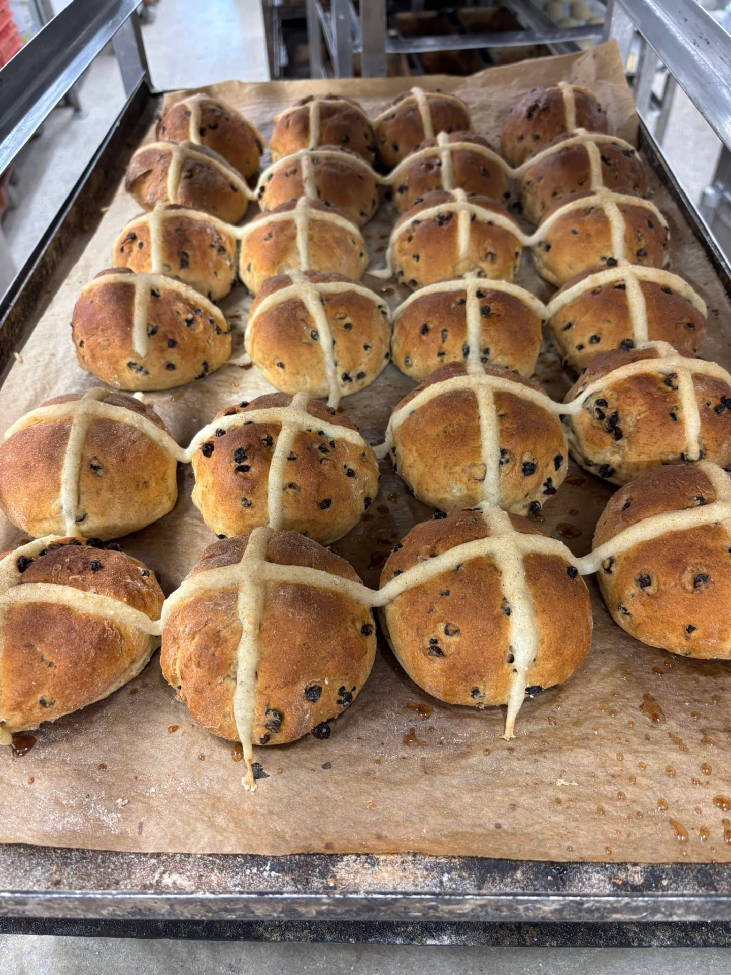 Tray of gluten free hot cross buns fresh from the oven